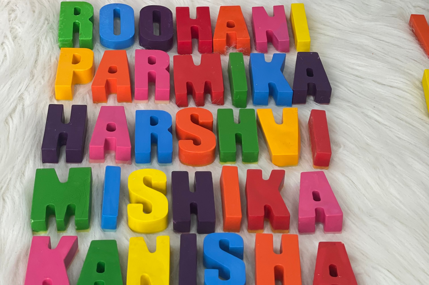 Kid holding single color blue personalized name crayons set